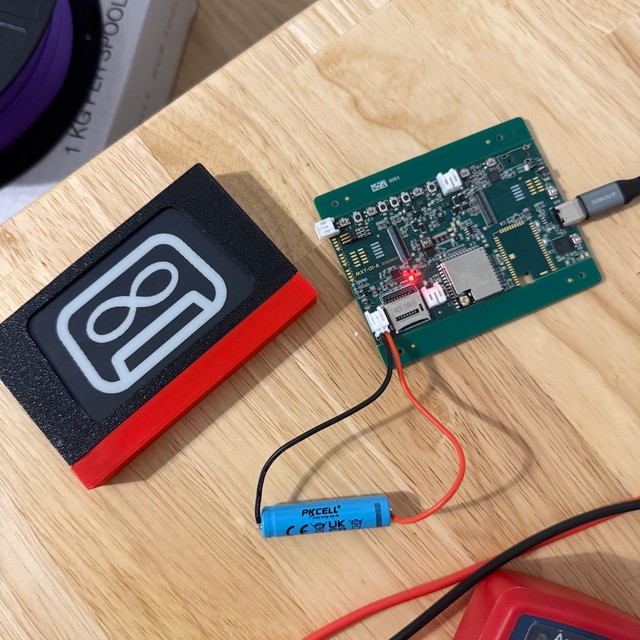 E-ink cassette with Mixfinity logo screensaver and bare printed circuit board